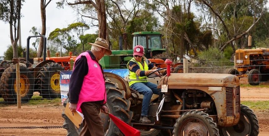 Young boy drives tractor